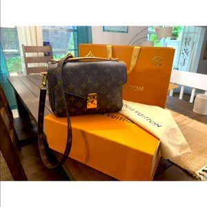 Louis Vuitton Pochette Métis Monogram Canvas crossbody bag with matching strap.